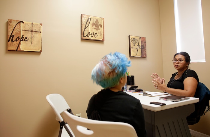 (Lynne Sladky | The Associated Press) In this Wednesday, June 22, 2016 photo, Theo Ramos, 14, left, meets with counselor Martha Vega, in Homestead, Fla. Ramos, always a tomboy before he even knew what the word transgender meant, feels more like a boy. But experts agree that any transitioning teen’s journey is difficult and fraught with indecision, anxiety and worry _ by the teens as well as their parents.