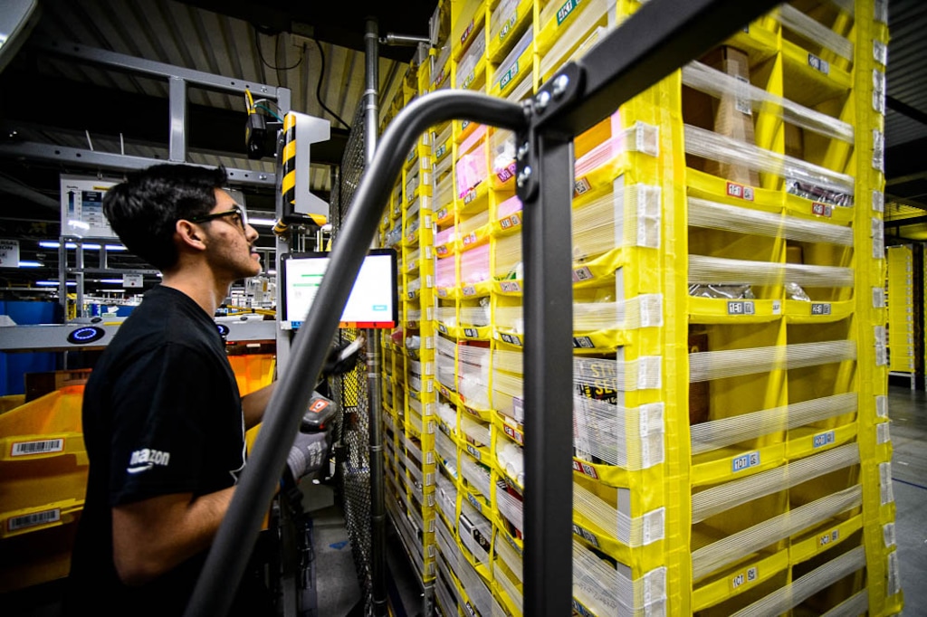 (Trent Nelson  |  Tribune file photo)  This April 17, 2019, file photo shows Sergio Sanchez working at Amazon's fulfillment center in Salt Lake City.