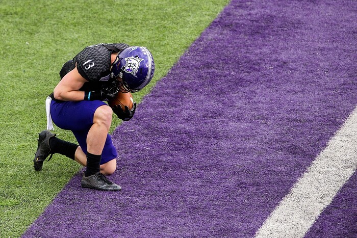 (Chris Detrick  |  The Salt Lake Tribune)  Weber State Wildcats wide receiver Drew Batchelor (13) kneels after making a touchdown catch during the game at Stewart Stadium Saturday, November 25, 2017.  