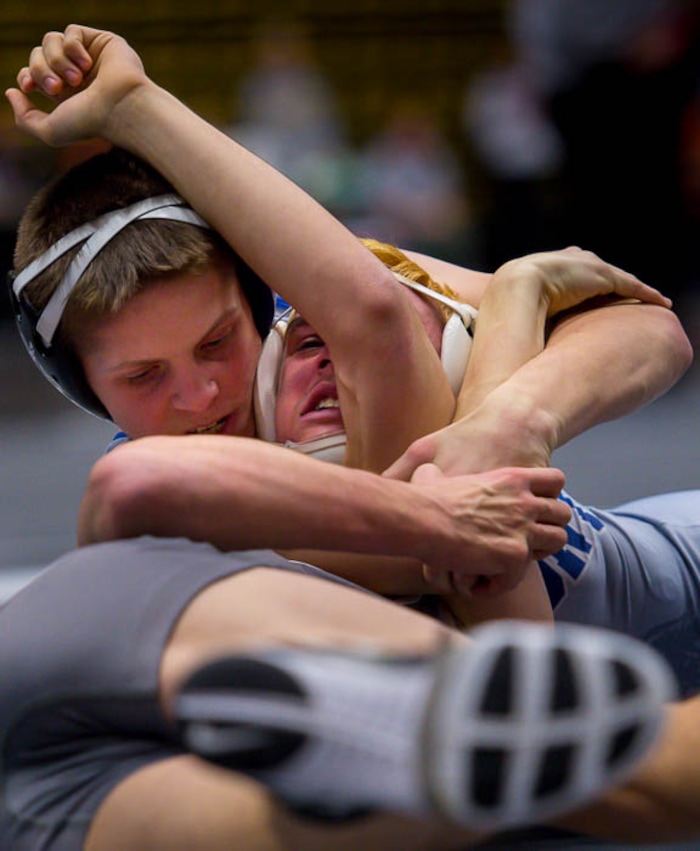 (Trent Nelson | The Salt Lake Tribune)  Fremont's Mason Denton, left, and Hunter's Brayden Warner, 6A State Championships, high school wrestling quarterfinals in Orem, Wednesday February 7, 2018.
