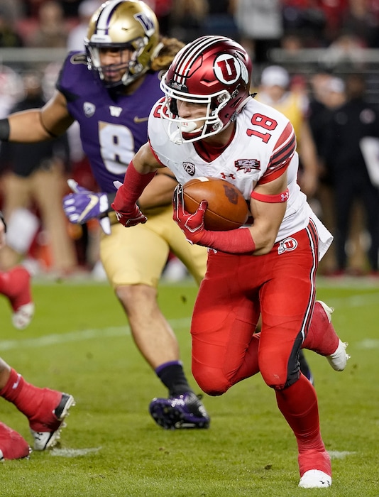 Utah wide receiver Britain Covey (18) carries against Washington during the first half of the Pac-12 Conference championship NCAA college football game in Santa Clara, Calif., Friday, Nov. 30, 2018. (AP Photo/Tony Avelar)