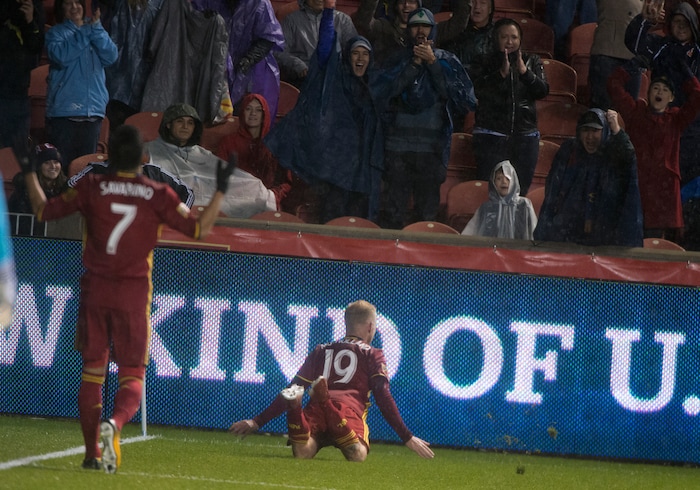 (Rick Egan  |  The Salt Lake Tribune)  Real Salt Lake midfielder Luke Mulholland (19) celebrates by diving on to the grass, after scoring a goal, in MLS soccer action, Real Salt Lake vs Seattle Sounders, in Sandy, Saturday, September 23, 2017.