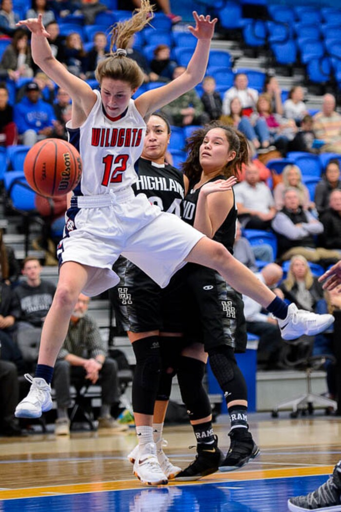 (Trent Nelson | The Salt Lake Tribune)  Highland's Misini Fifita (34) strips the ball from Woods Cross's Paige McKenna (12) as Woods Cross faces Highland in the 5A High School Girls' Basketball Tournament at SLCC in Taylorsville, Wednesday Feb. 21, 2018.