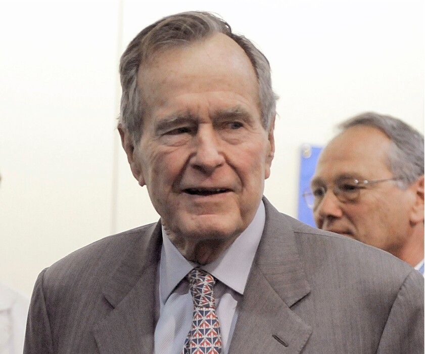 FILE - In a Tuesday, Dec. 2, 2008 file photo, former President George H. W. Bush leaves a news conference at the Houston hospital where his wife Barbara has spent a week after surgery for a perforated ulcer. Another woman has stepped forward to accuse former President George H.W. Bush of inappropriately touching her. Roslyn Corrigan told Time magazine that she was 16 when Bush grabbed her buttocks as she posed for a photo with him in 2003 at a gathering of CIA officers north of Houston. (AP Photo/Pat Sullivan, File)