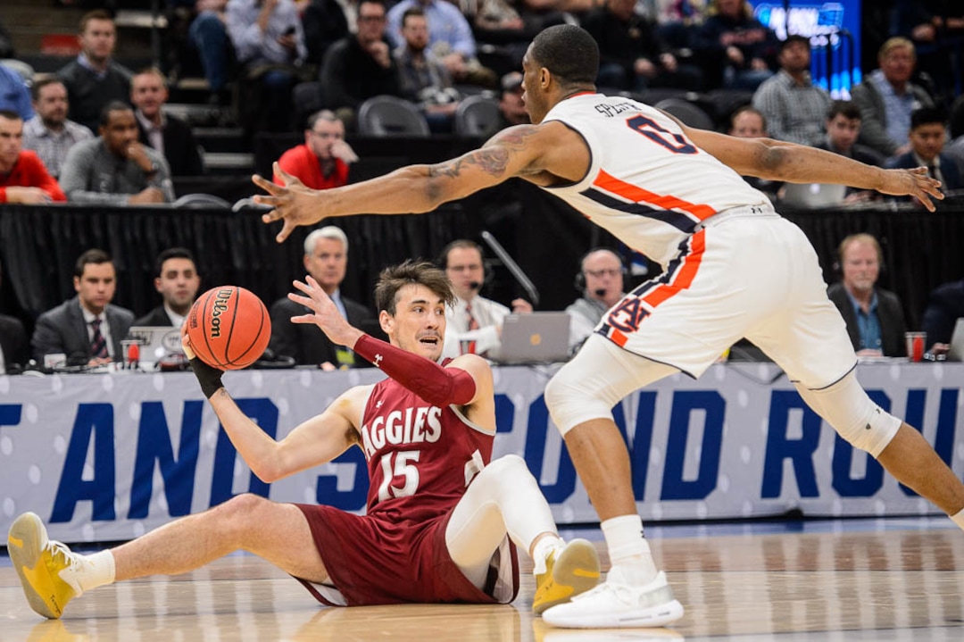 (Trent Nelson | The Salt Lake Tribune)  New Mexico State Aggies forward Ivan Aurrecoechea (15) defended by Auburn Tigers forward Horace Spencer (0) as Auburn faces New Mexico State in the 2019 NCAA Tournament in Salt Lake City on Thursday March 21, 2019.