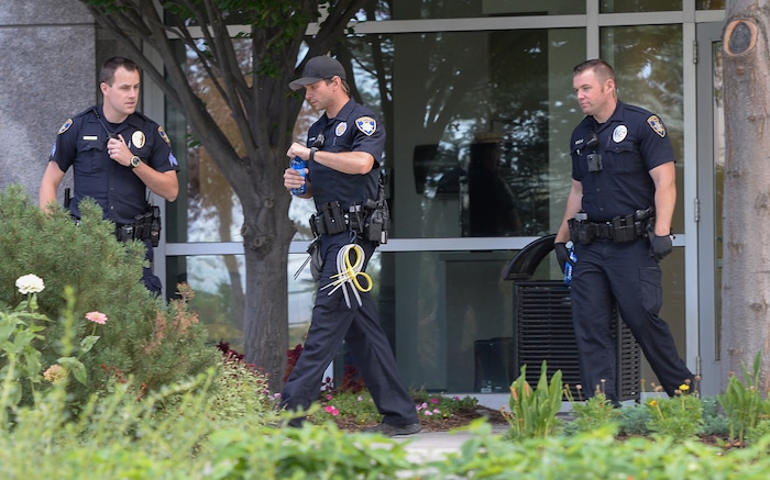 (Francisco Kjolseth  |  The Salt Lake Tribune)  Law enforcement leaves the building where activists staged a protest against a private prison company with contracts to hold undocumented immigrants on Thursday, July 12, 2018, at the headquarters of Management and Training Corporation in Centerville.