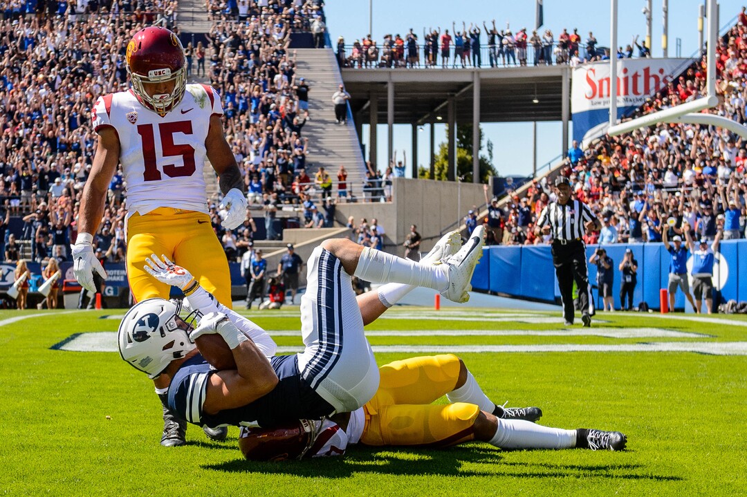 (Trent Nelson  |  The Salt Lake Tribune)  Brigham Young Cougars wide receiver Dax Milne (82) scores a touchdown as BYU hosts USC, NCAA football in Provo on Saturday Sept. 14, 2019.