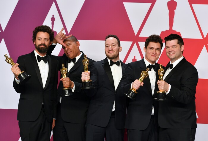 Bob Persichetti, from left, Peter Ramsey, Rodney Rothman, Phil Lord and Christopher Miller pose with the award for best animated feature film for "Spider-Man: Into the Spider-Verse" in the press room at the Oscars on Sunday, Feb. 24, 2019, at the Dolby Theatre in Los Angeles. (Photo by Jordan Strauss/Invision/AP)