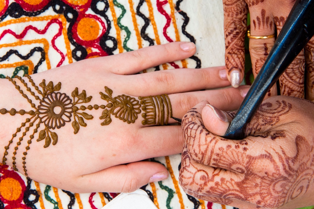 (Rick Egan  |  The Salt Lake Tribune)   Jane Henna Artists, Rupali Munot paints a hand at the Utah Arts Festival, Saturday, June 22, 2019.
