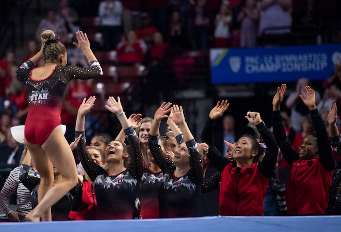 (Rick Egan  |  The Salt Lake Tribune)    Utah hug-fives MyKayla Skinner after her floor routine, in the PAC-12 Gymnastics Championships at the Maverik Center, Saturday, March 23, 2019.


