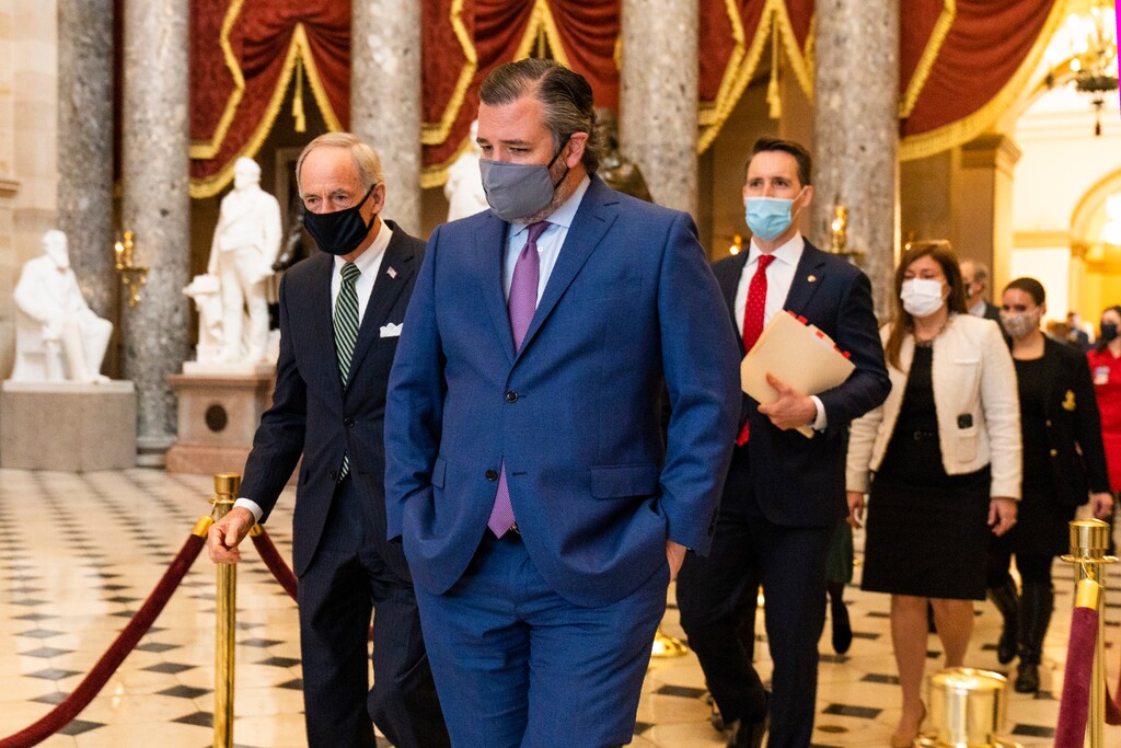 (Manuel Balce Ceneta | AP photo)

Sen. Ted Cruz, R-Texas, front, followed by Sen. Josh Hawley, R-Mo., walk from the House Chamber following a Senate procession carrying boxes holding Electoral College votes to the House Chamber for a joint session to confirm the Electoral College votes, Wednesday, Jan. 6, 2021, in Washington.