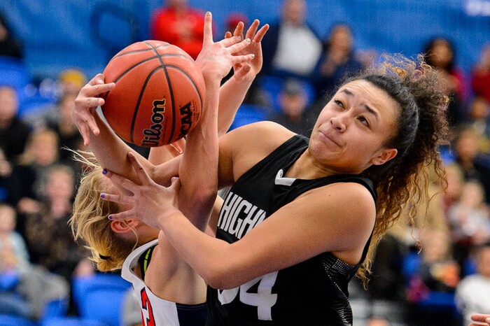 (Trent Nelson | The Salt Lake Tribune)  Highland's Misini Fifita (34) pulls in a rebound as Woods Cross faces Highland in the 5A High School Girls' Basketball Tournament at SLCC in Taylorsville, Wednesday Feb. 21, 2018.