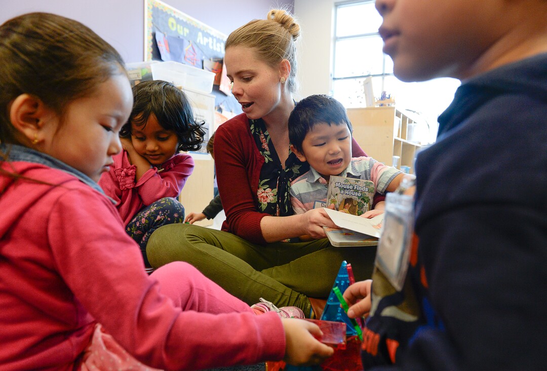 (Francisco Kjolseth  |  The Salt Lake Tribune)  Brianna Evans, lead teacher at Head Start of South Salt Lake reads with 3, 4, and 5-year-olds who fall under the 100 percent poverty line. The center is an example of how the new homeless shelters will help children facing poverty. Shelter the Homeless, a nonprofit organization leading efforts surrounding the new resource centers, is provided an update on fundraising efforts surrounding the Larry H. and Gail Miller familyÕs $10 million matching grant. Numerous organizations, families and individuals have donated to help the new resource centers and needed services they will provide. 