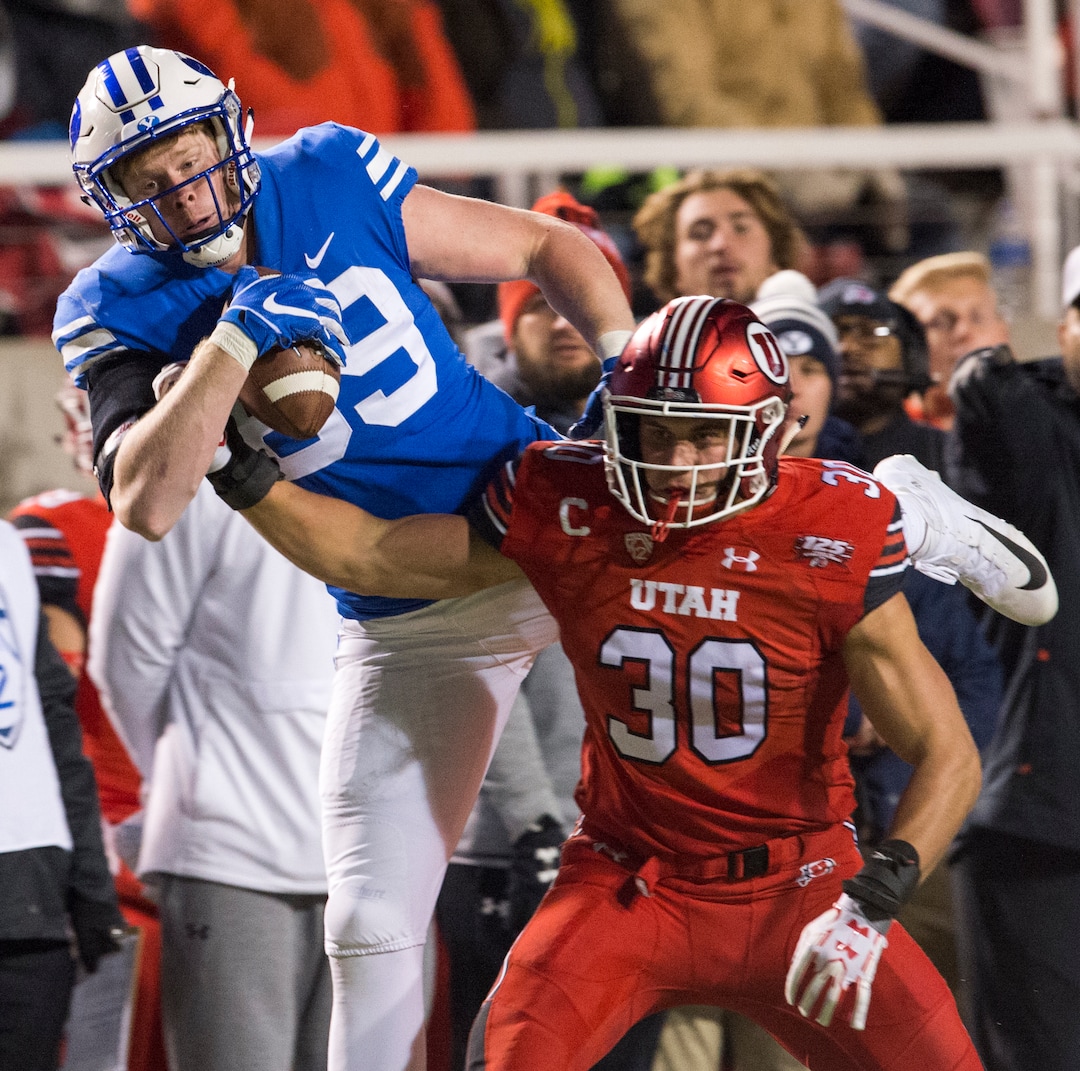 (Rick Egan  |  The Salt Lake Tribune)        Brigham Young Cougars tight end Matt Bushman (89) grabs a one handed pass, as Utah Utes linebacker Cody Barton (30) defends, in football action between the Brigham Young Cougars and the Utah Utes, at Rice-Eccles Stadium, Saturday, November 24, 2018.