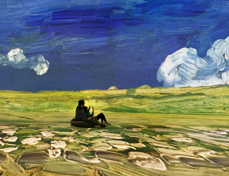 (Leah Hogsten | The Salt Lake Tribune) Visitors take in the sight, sound and color of Beyond Van Gogh Salt Lake City, Oct. 9, 2021. Beyond Van Gogh Salt Lake City runs now through November at Atmosphere Studios.