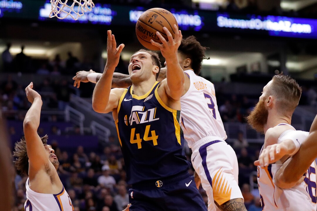 Utah Jazz forward Bojan Bogdanovic (44) shoots against the Phoenix Suns during the first half of an NBA basketball game, Monday, Oct. 28, 2019, in Phoenix. (AP Photo/Matt York)