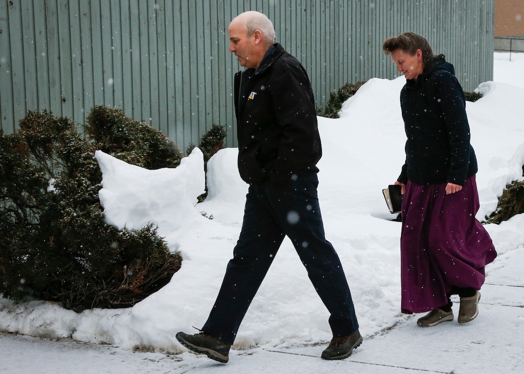 Gail Blackmore, right, and James Oler arrive at the courthouse in Cranbrook, British Columbia, Friday, Feb. 3, 2017. Two people linked to the polygamous community of Bountiful, B.C., could have foreseen that their actions would lead to a girl having sex with the church's prophet well before her 14th birthday, a B.C. Supreme Court judge said as he convicted estranged husband and wife Brandon Blackmore and Gail Blackmore Friday. He found Oler not guilty of the same charge. (Jeff McIntosh/The Canadian Press via AP)