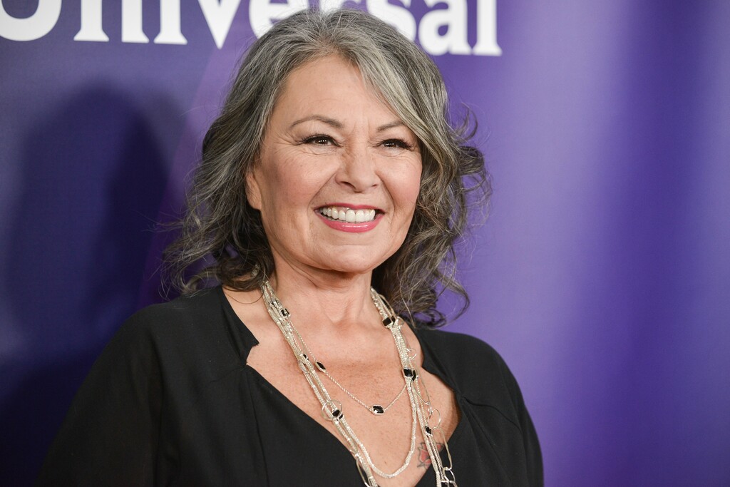 FIlE - In this April 8, 2014, file photo, Roseanne Barr arrives at the NBC Universal Summer Press Day in Pasadena, Calif. The unprecedented sudden cancellation of ABC's TV’s top comedy "Roseanne" has left a wave of unemployment and uncertainty in its wake. Barr’s racist tweet and the almost immediate axing of her show put hundreds of people out of work. (Photo by Richard Shotwell/Invision/AP, File)
