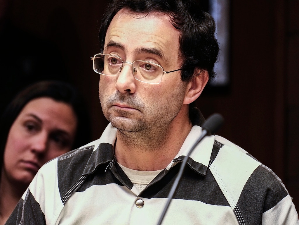 FILE - In this Friday, Feb. 17, 2017, file photo, Dr. Larry Nassar listens to testimony of a witness during a preliminary hearing, in Lansing, Mich. The former sports doctor at Michigan State University who specialized in treating gymnasts has been charged with sexual assault. Dr. Nassar was charged Wednesday, Feb. 22,  in two Michigan counties. Online records show he's facing nine charges in Ingham county, including first-degree criminal sexual conduct against a victim under age 13. Nassar had a clinic at Michigan State, where he treated members of the gymnastics team and younger regional gymnasts. (Robert Killips/Lansing State Journal via AP, File)
