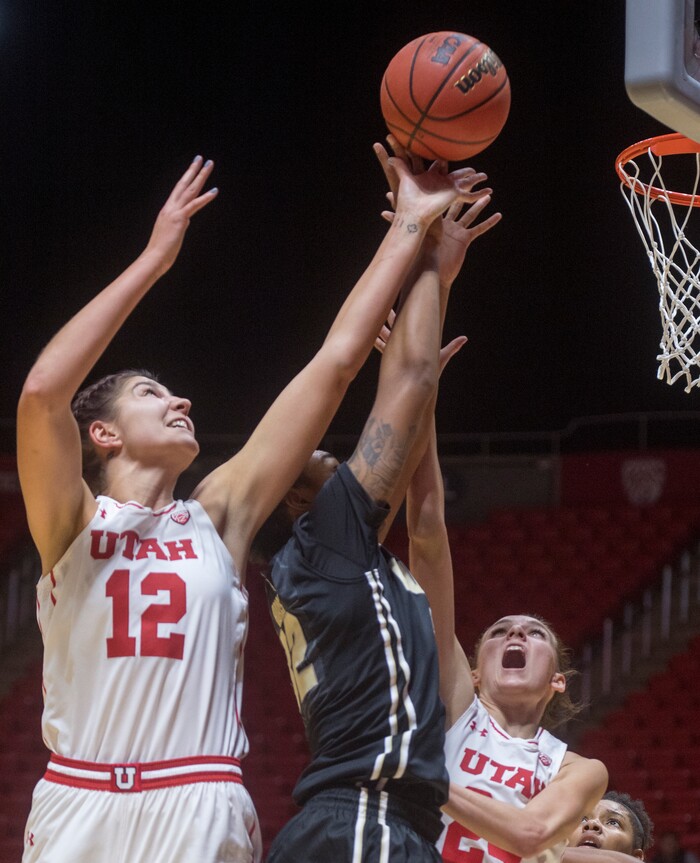 (Rick Egan  |  The Salt Lake Tribune)  Utah Utes forward Emily Potter (12) goes up for a rebound along with Purdue Boilermakers forward Ae'Rianna Harris (32), in basketball action Utah Utes vs. Purdue Boilermakers, at the Jon M. Huntsman Center, Monday, November 20, 2017.
