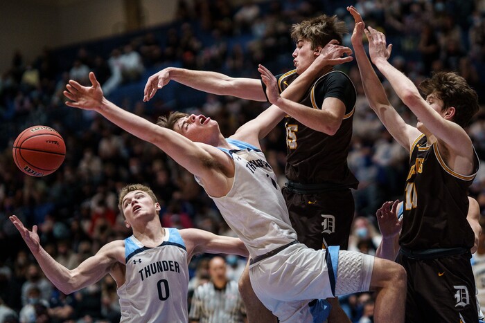 (Trent Nelson  |  The Salt Lake Tribune) Westlake's Noah Madsen and Noah McCord reach for a loose ball as Davis defeats Westlake High School in the 6A boys basketball state championship game, in Taylorsville on Saturday, March 6, 2021.