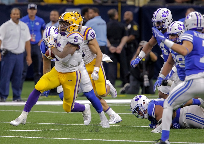 LSU running back Derrius Guice (5) breaks into the open against BYU during the second half of an NCAA college football game in New Orleans, Saturday, Sept. 2, 2017. (AP Photo/Scott Threlkeld)