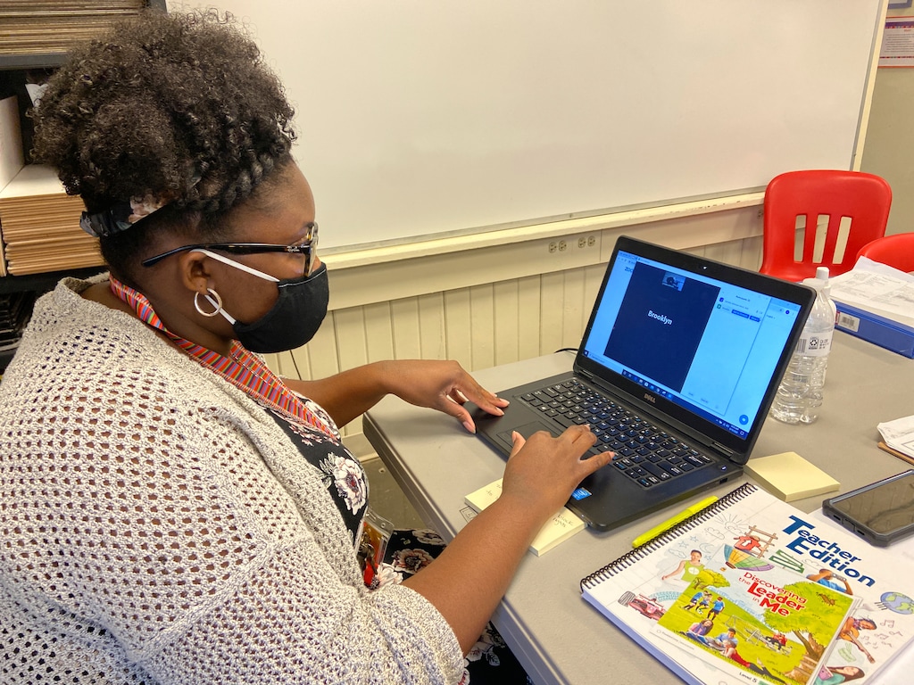 (Bill Graham | The Meridian Star via AP file photo)  Fifth grade math teacher Jymeka Johnson logs into a Zoom session at Poplar Springs Elementary School in Meridian, Miss., Monday, Aug. 10, 2020.