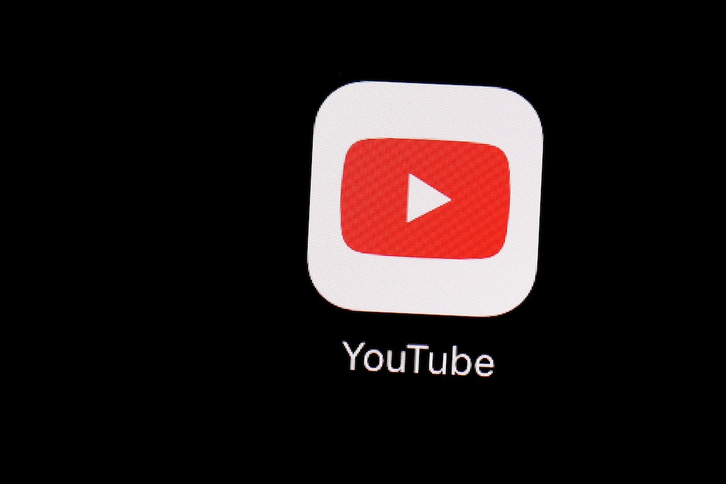 (Patrick Semansky | The Associated Press) This March 20, 2018 file photo shows the YouTube app on an iPad in Baltimore. The video-sharing network owned by Google is cracking down on harmful or dangerous pranks. Updated policies no longer allow challenges that present “an apparent risk of death” and ban content featuring children “participating in dangerous challenges that pose an imminent risk of injury or bodily harm.”