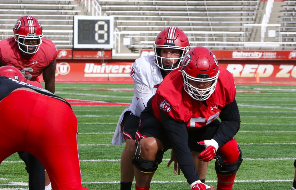 (Photo courtesy of Utah athletics) Quarterback Jake Bentley takes a snap from center Orlando Umana during Utah's scrimmage on Saturday, Oct. 24, 2020.