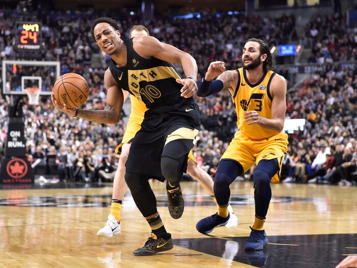 Toronto Raptors guard DeMar DeRozan (10) drives as Utah Jazz guard Ricky Rubio (3) defends during the second half of an NBA basketball game Friday, Jan. 26, 2018, in Toronto. (Frank Gunn/The Canadian Press via AP)