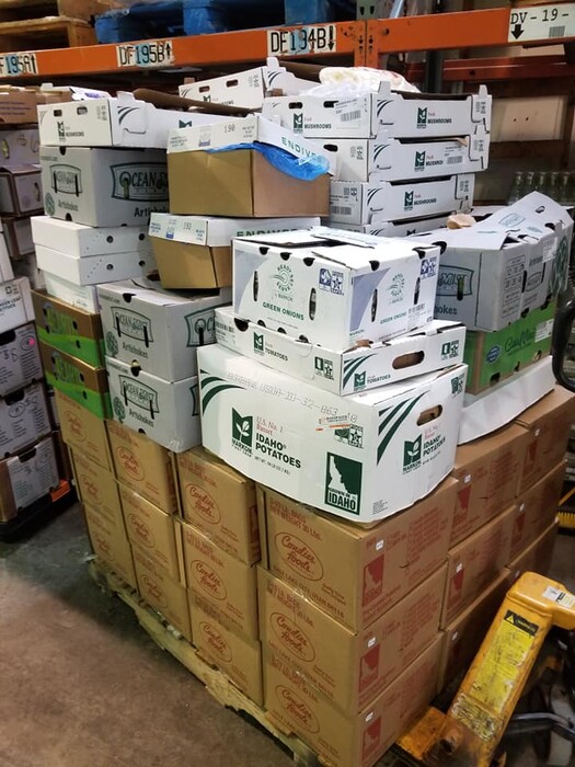 (Photo courtesy of Paul Stoddard) Pallets of bulk produce sit in Nickey's Food Surplus Warehouse March 24, 2020. Owner Paul Stoddard is selling his stock cheaply to help turn over product and fill in the gaps left by grocery store shortages.