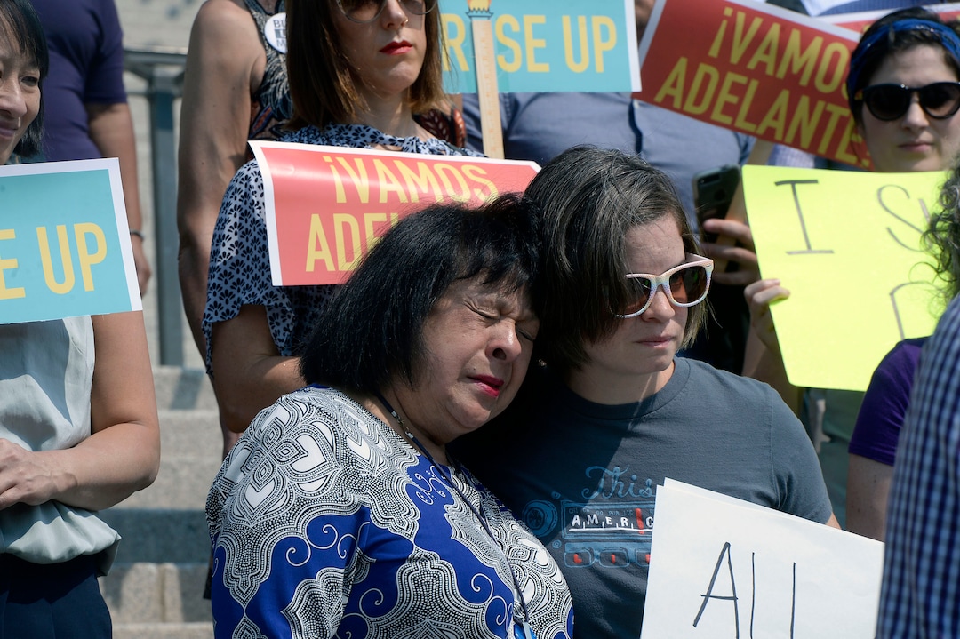 (Al Hartmann  |  The Salt Lake Tribune) 	
Brandy Farmer, president of Centro Civico Americano, left, hugs friend Kristen Hodges on the steps of the Utah Capitol on Tuesday, Sept. 5, 2017, as they gathered to protest the Trump adminstration's plans to end the DACA program. Individuals, including 'Dreamers," spoke out for Congress to come up with alternative legislation.