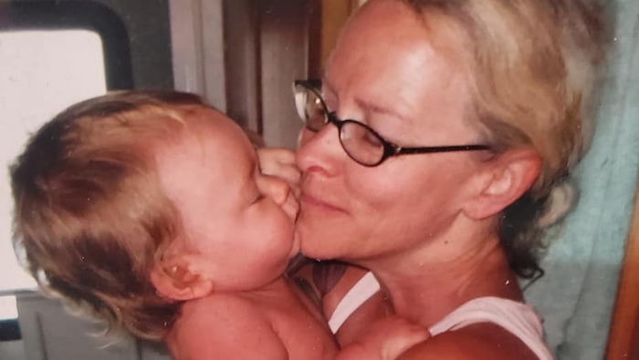 (Heavy Metal Shop) A photo of Angie Kirk with one of her grandchildren. The photo is taped to the register at the Heavy Metal Shop in Downtown Salt Lake City.