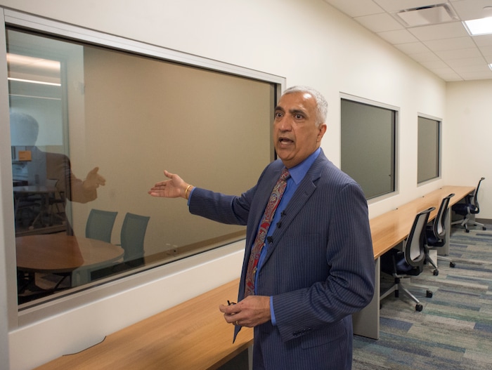 (Rick Egan  |  The Salt Lake Tribune)    Sim Gill, Salt Lake County District Attorney, points out the interview rooms on the second floor of the new Salt Lake County District Attorney building in Salt Lake City, Friday, March 9, 2018.


