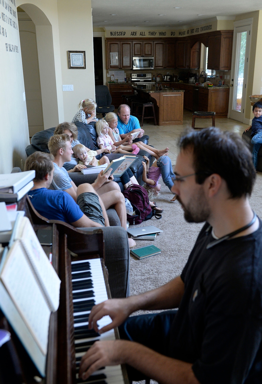 (Al Hartmann  |  The Salt Lake Tribune)
Believers in Denver Snuffer's Remnant movement gather in a Sandy home for a fellowship meeting Sunday, Aug. 13, to sing songs and partake of the sacrament.