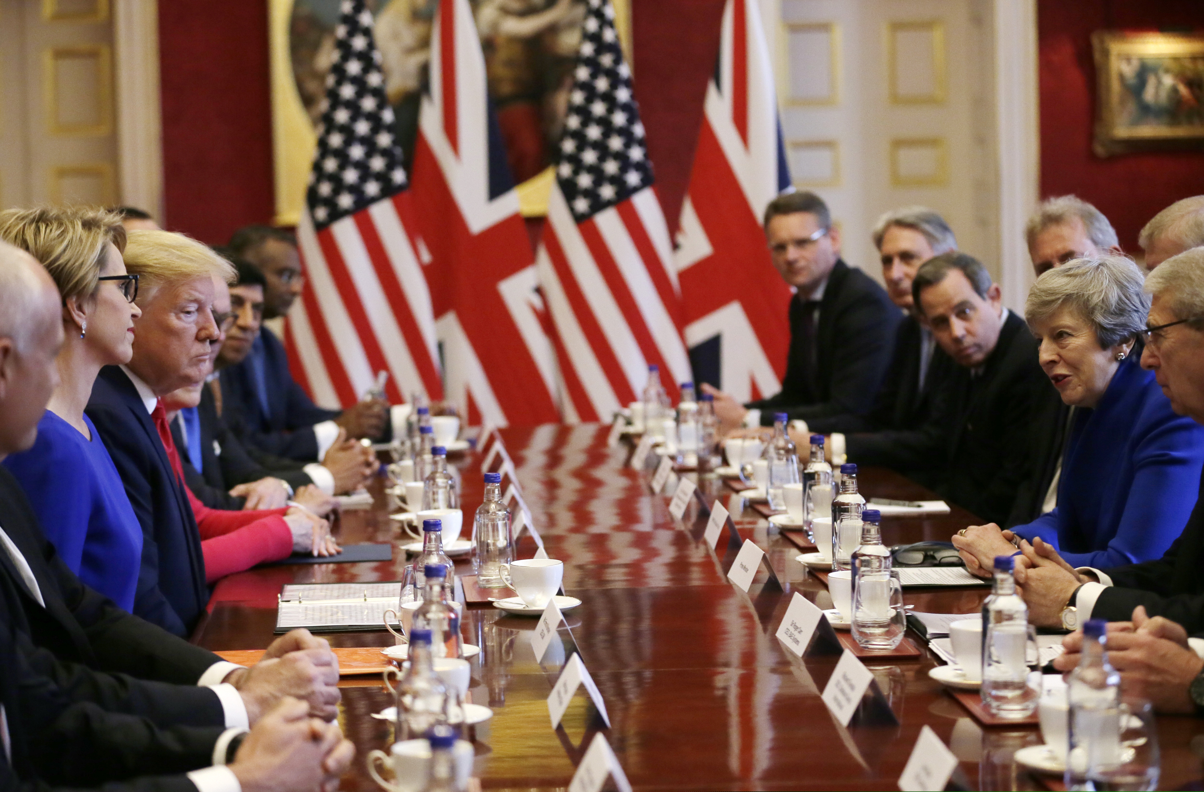 U.S President Donald Trump, center left, and British Prime Minister Theresa May, center right, attend a business roundtable event at St. James's Palace, London, Tuesday June 4, 2019. (AP Photo/Tim Ireland)