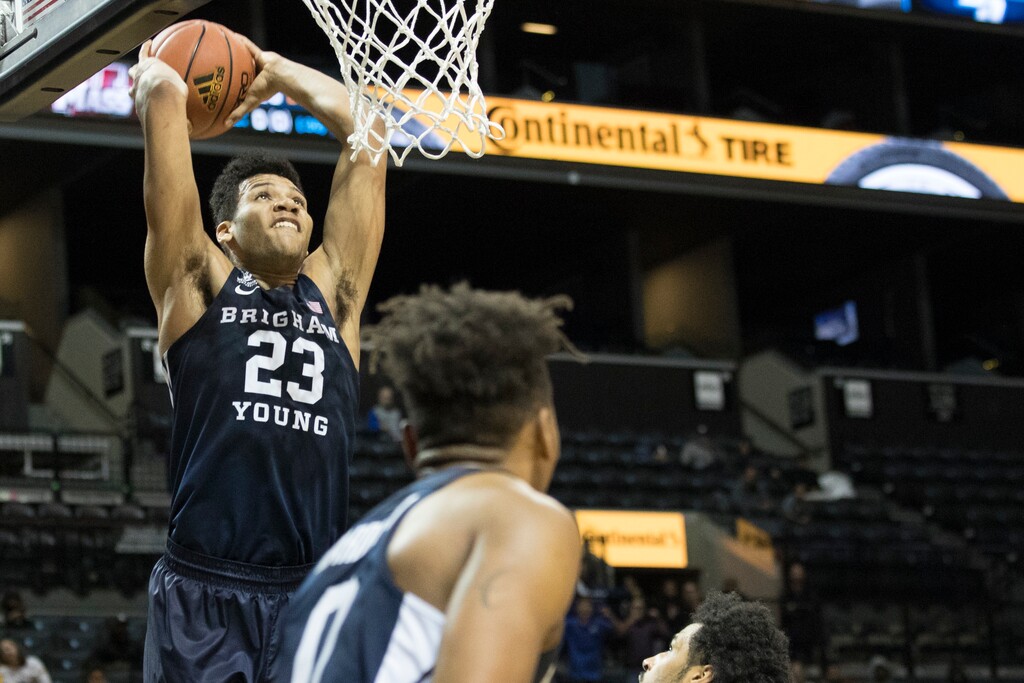 BYU forward Yoeli Childs (23) scores the winning goal during the final seconds of an NCAA basketball game against UMass, Saturday, Nov. 25, 2017, in New York. BYU won 68-66. (AP Photo/Mary Altaffer)