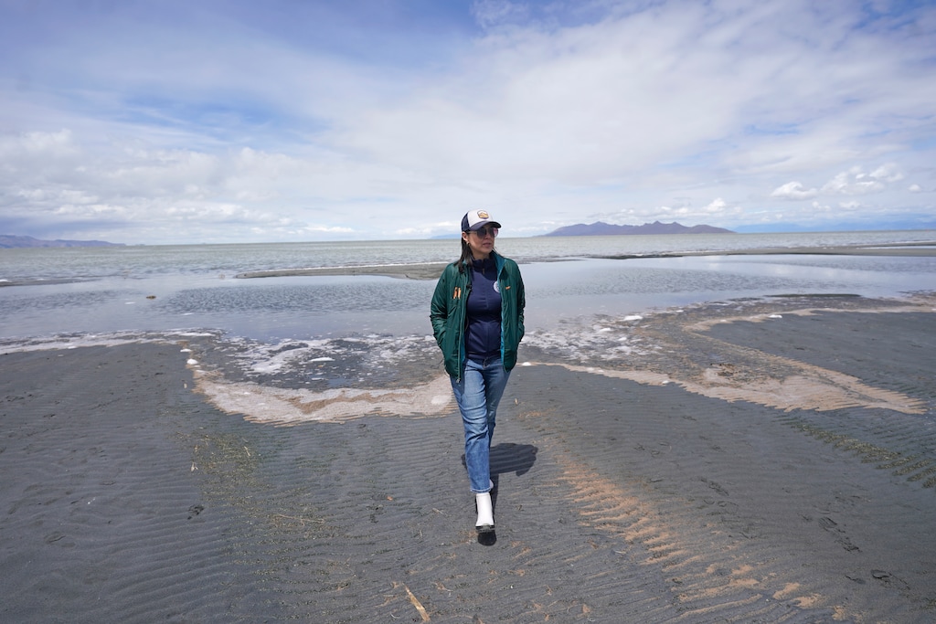 (Rick Bowmer | Pool) Lt. Gov. Deidre Henderson walks along the Great Salt Lake, Tuesday, May 3, 2022, near Salt Lake City. Henderson toured the embattled saline lake with Utah lawmakers and Department of Natural Resources officials, a week after the DNR projected Great Salt Lake will likely reach a new historic low this year.