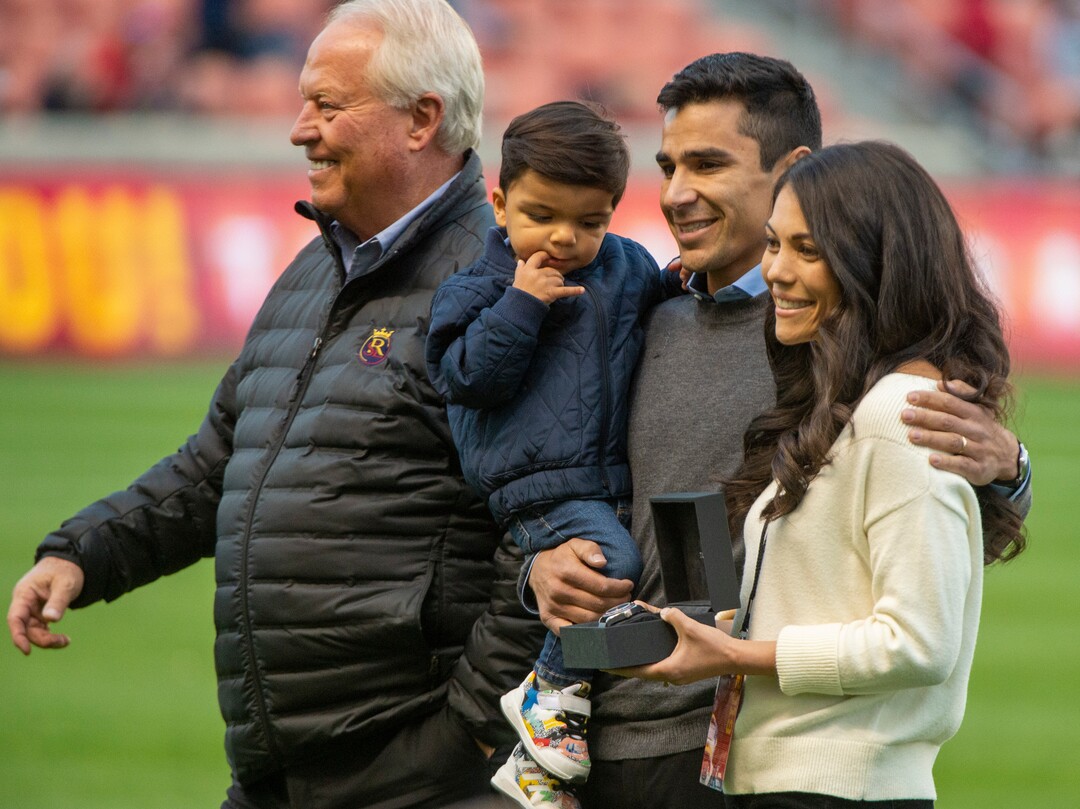 (Rick Egan  |  The Salt Lake Tribune)   Real Salt Lake owner Dell Loy Hansen joins Tony Beltran as he holds his son Kaito and stands with his wife Teal, as he is honored at half time of the match between Real Salt Lake and Houston Dynamo  at Rio Tinto Stadium, Sunday, Sept. 29, 2019.