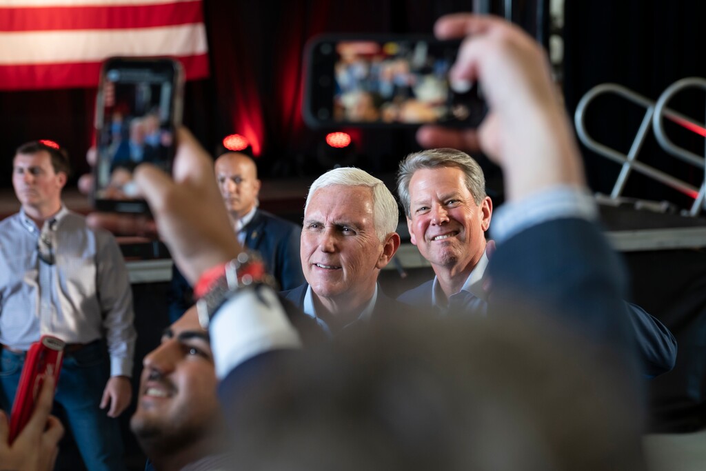 (Nicole Craine | The New York Times)

Former Vice President Mike Pence, left, and Gov. Brian Kemp meet with constituents during a campaign stop in Kennesaw, Ga., May 23, 2022.
