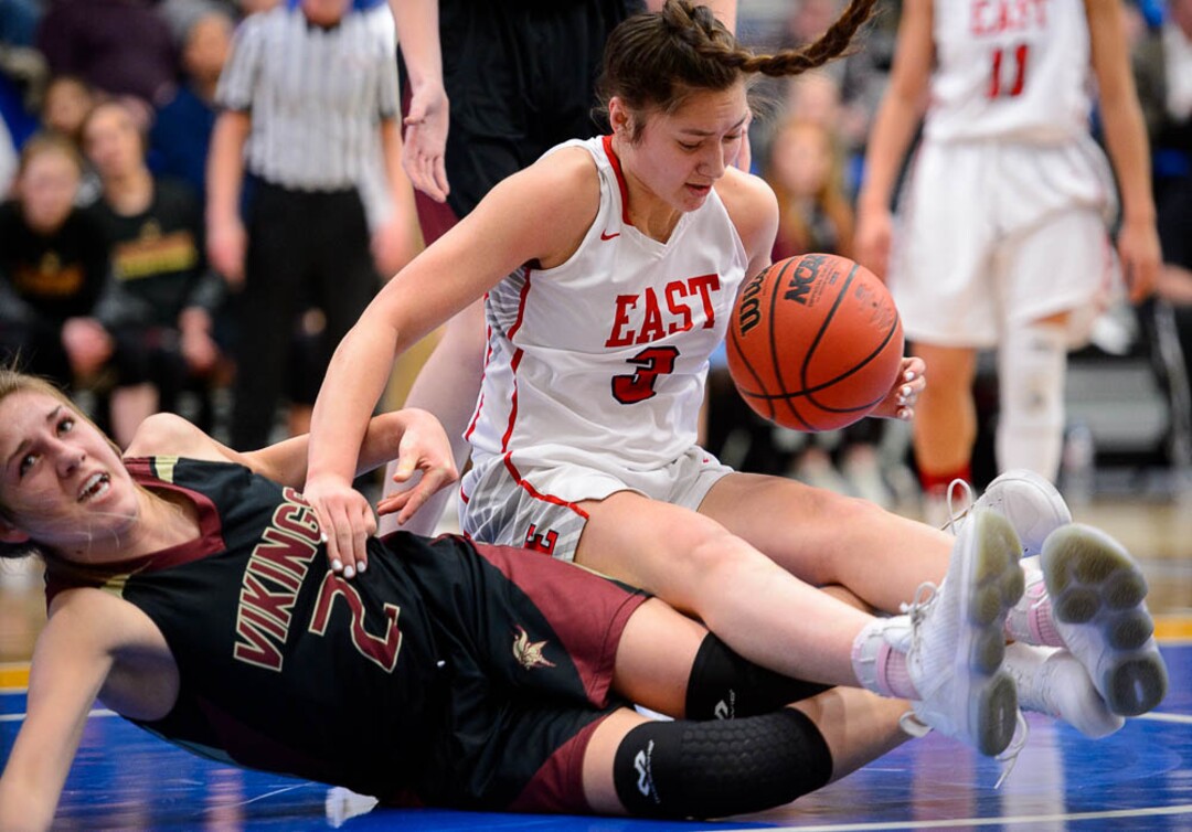 (Trent Nelson | The Salt Lake Tribune)  Viewmont's Emma Carr (2) and East's Lealani Falatea (3) grapple for the ball as East faces Viewmont in the 5A High School Girls' Basketball Tournament at SLCC in Taylorsville, Wednesday Feb. 21, 2018.
