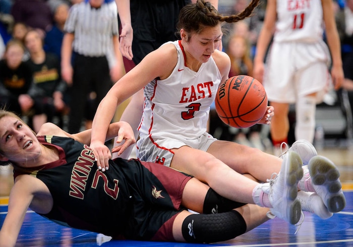 (Trent Nelson | The Salt Lake Tribune)  Viewmont's Emma Carr (2) and East's Lealani Falatea (3) grapple for the ball as East faces Viewmont in the 5A High School Girls' Basketball Tournament at SLCC in Taylorsville, Wednesday Feb. 21, 2018.