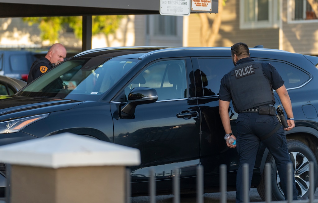 (Rick Egan | The Salt Lake Tribune) Salt Lake City Police look through car windows as they investigate a shooting at the Pebble Creek Apartments on 1700 South, where one person was killed and two were injured, on Monday, June 6, 2022.