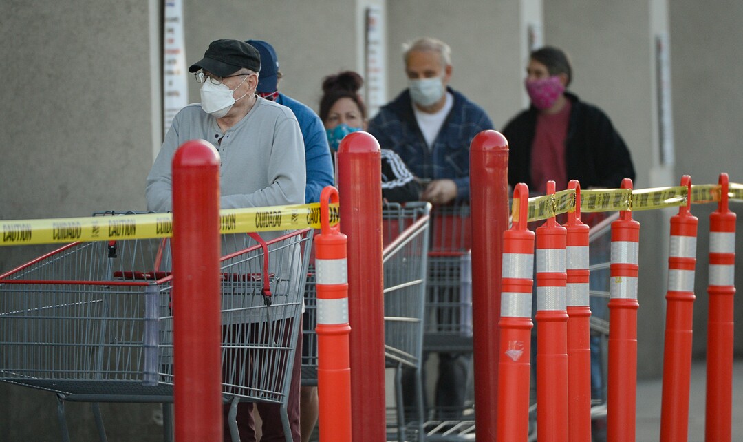 (Francisco Kjolseth  |  The Salt Lake Tribune) Costco begins implementing a policy on Monday, May 4, 2020, that everyone in the store, including shoppers, have to wear a mask, as people shop early in Salt Lake City during the coronavirus pandemic.
