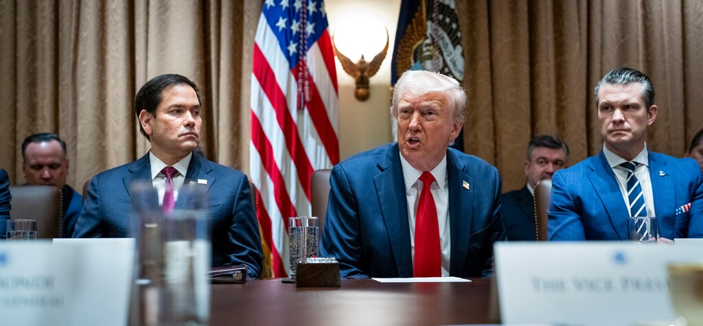 (Doug Mills | The New York Times) President Donald Trump speaks as Secretary of State Marco Rubio, left, and Secretary of Defense Pete Hegseth, right, look on during his first Cabinet meeting in the Cabinet Room of the White House in Washington, on Wednesday, Feb. 26, 2025.