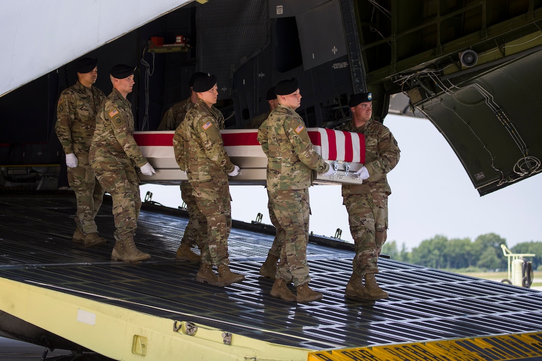 (Alex Brandon  |  AP Photo) An Army carry team moves a transfer case containing the remains of U.S. Army Sgt. 1st Class Elliott J. Robbins, at Dover Air Force Base, Del., Tuesday, July 2, 2019. According to the Department of Defense, Robbins, of Ogden, Utah, assigned to the 10th Special Forces Group died while supporting Operation Freedom's Sentinel.