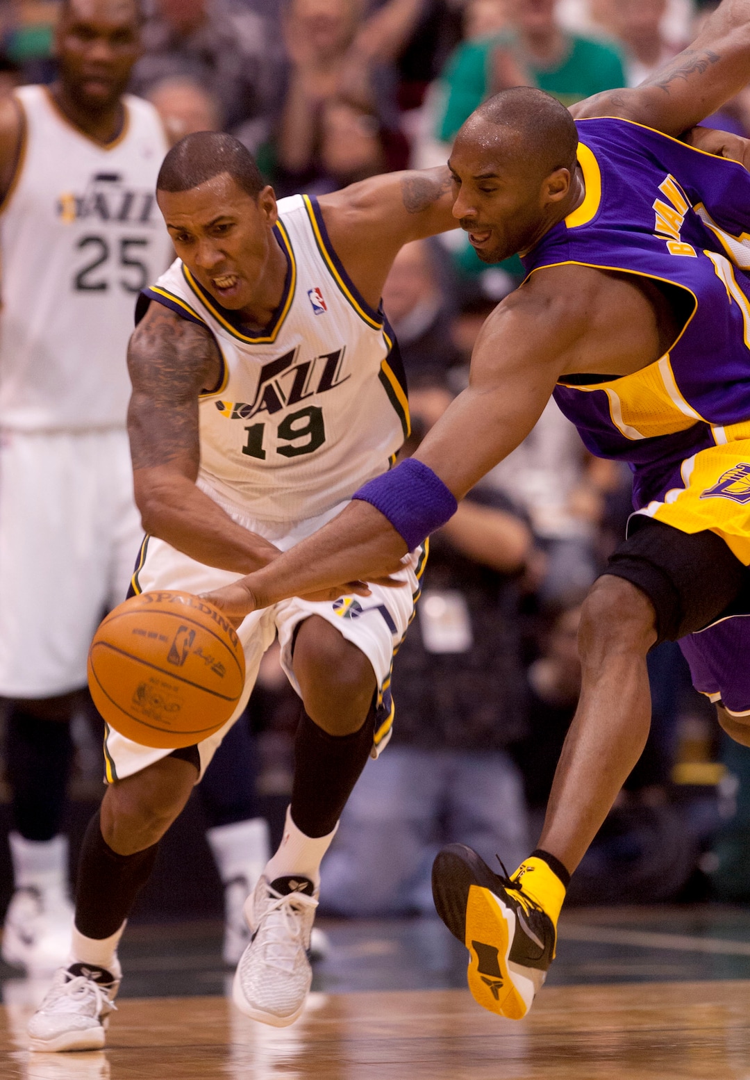 (Trent Nelson  |  The Salt Lake Tribune) Utah Jazz guard Raja Bell (19) and Los Angeles Lakers' Kobe Bryant (24) chase down a loose ball as the Utah Jazz host the Los Angeles Lakers, NBA basketball Saturday, February 4, 2012 at EnergySolutions Arena in Salt Lake City, Utah.