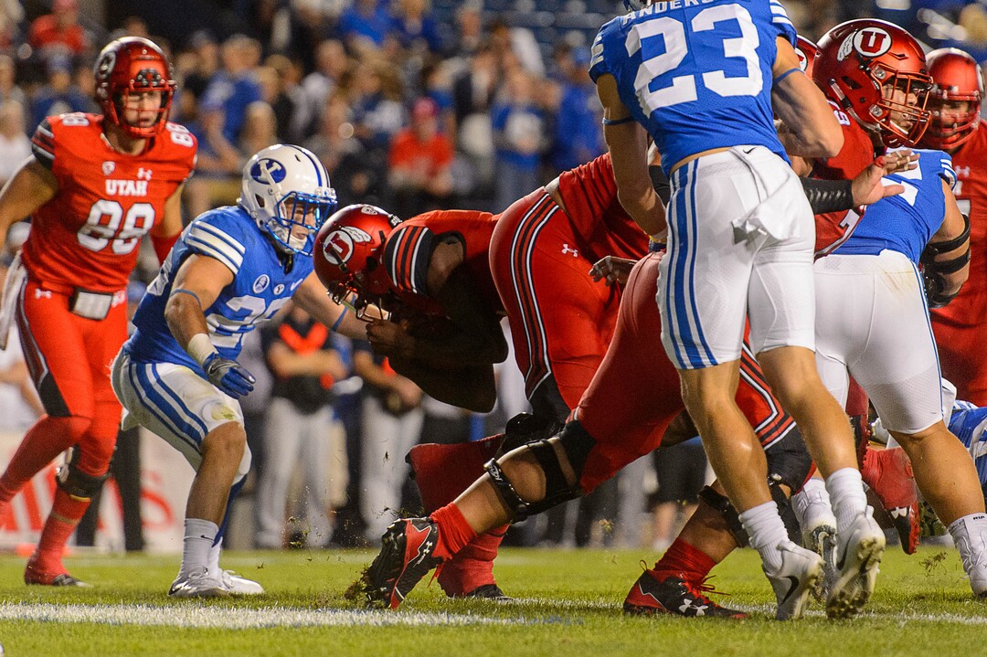 (Trent Nelson | The Salt Lake Tribune)  Utah Utes quarterback Tyler Huntley (1) dives for a touchdown as BYU hosts Utah, NCAA football in Provo, Saturday September 9, 2017.