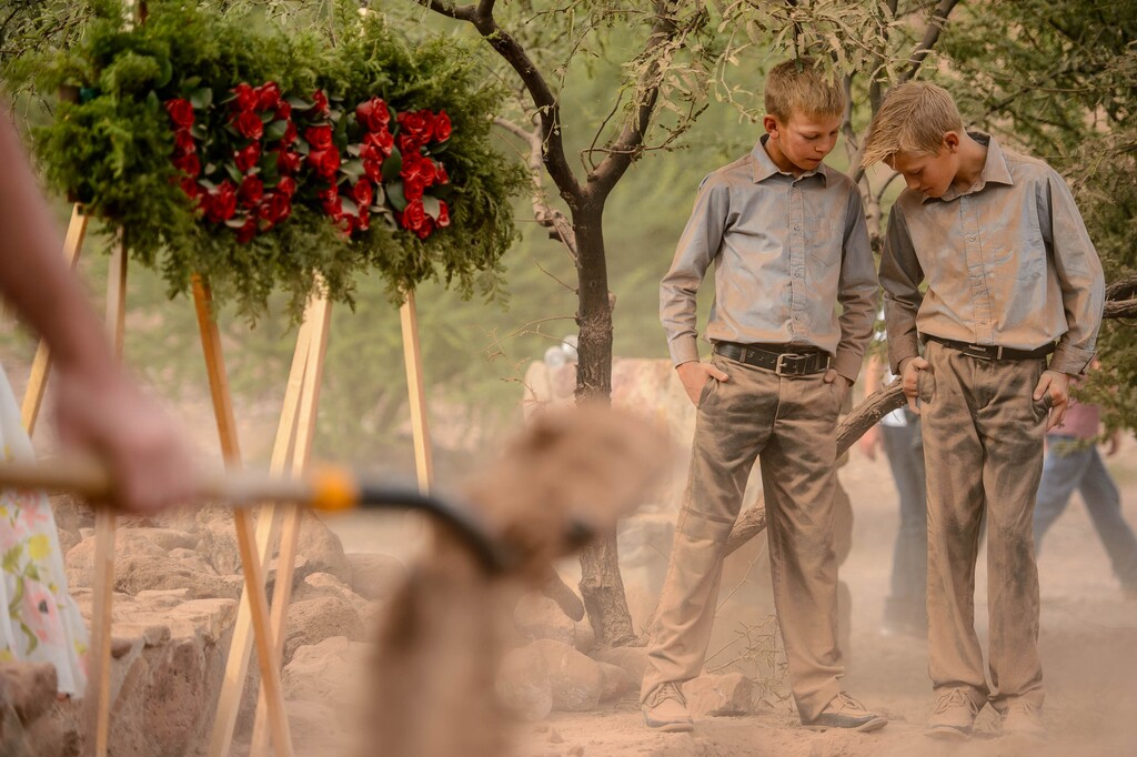 (Trent Nelson  | Salt Lake Tribune file photo)
Two boys are coated in dust as dirt is shoveled after the funeral for Dawna Langford and two of her children, Trevor and Rogan, in La Mora, Sonora, on Thursday, Nov. 7, 2019.