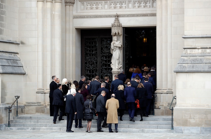 Mourners file into the Washington National Cathedral before a State Funeral for former President George H.W. Bush in Washington, Wednesday, Dec. 5, 2018. (AP Photo/Patrick Semansky)